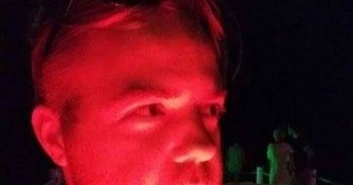 Close-up of a person's face with a strong, intense expression