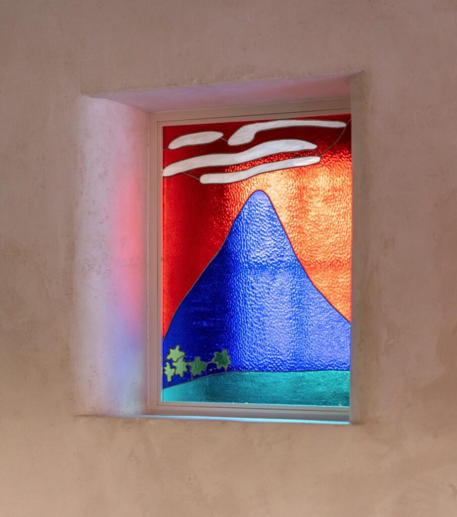 Colorful Stained Glass Window Depicting Mountainous Landscape
