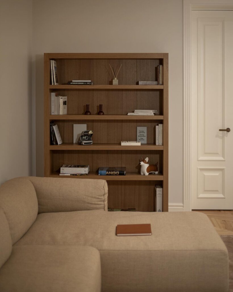 A Cozy Living Room with a Wooden Bookshelf