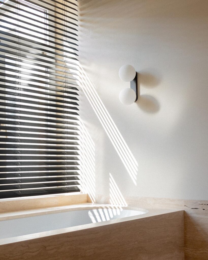 Minimalist Interior Design with Striped Blinds and Wall Sconces
