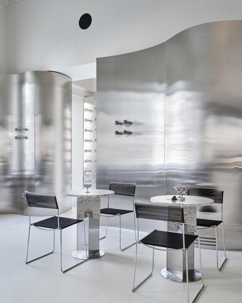 Minimalist Interior Design Space With Sleek Furniture And Curved Architectural Elements