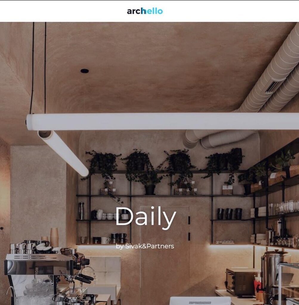 Minimalist Interior Design Space with Exposed Concrete Walls and Shelves Displaying Kitchen Items