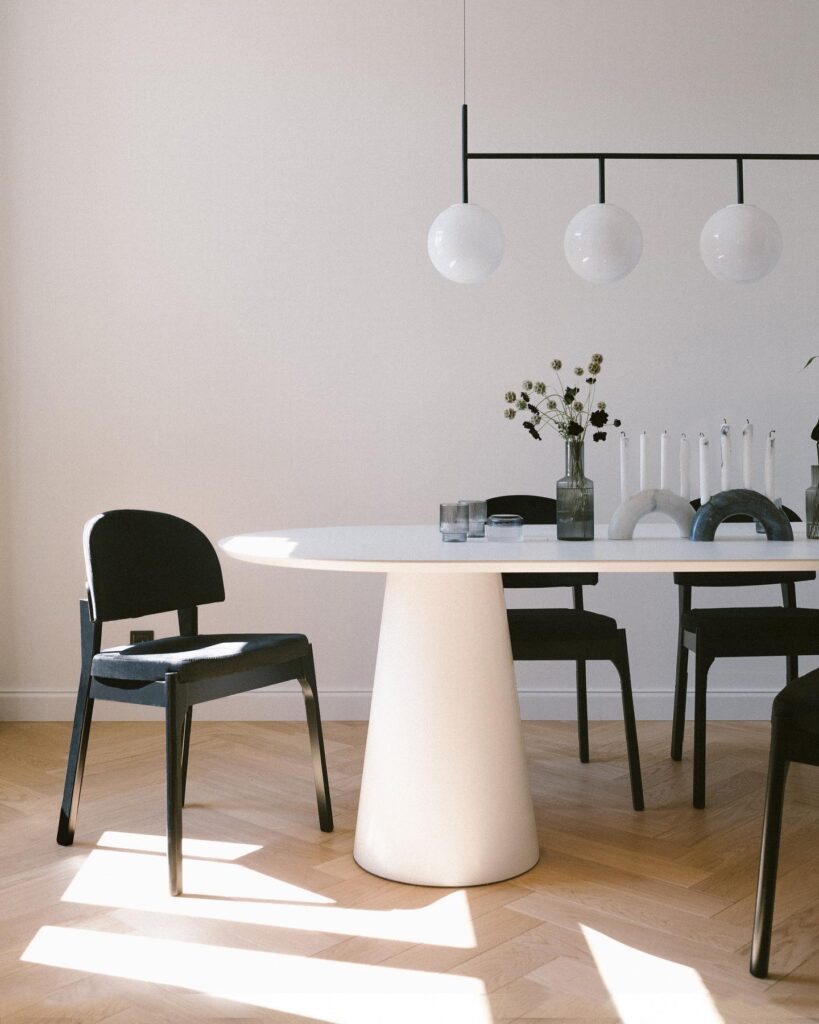 A Modern Dining Room With Minimalist Furniture And Lighting