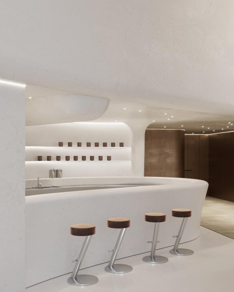 A Modern Interior Design Space Featuring a White Countertop, Shelves, and Stools