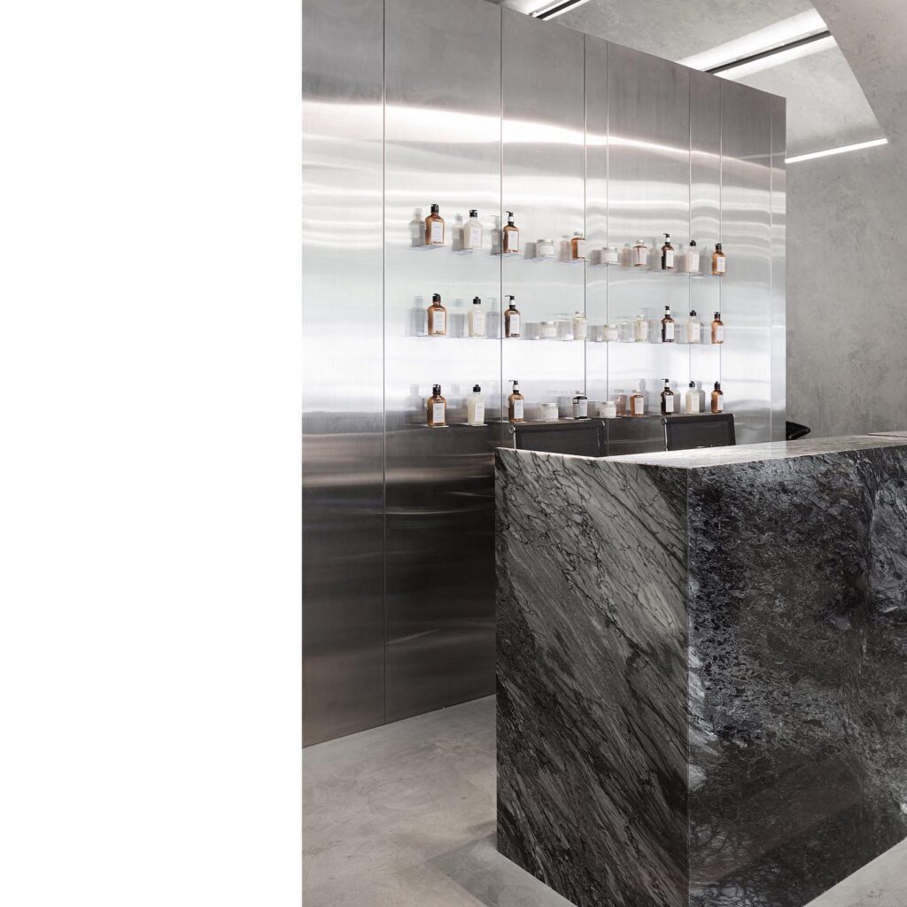 A Modern Interior Design with Sleek Shelving and a Marble Counter