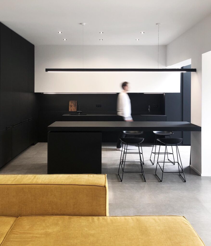 A Modern, Minimalist Kitchen And Dining Area