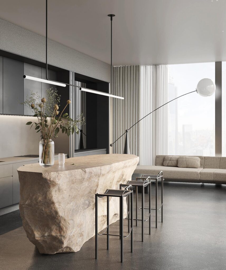 The Alt Text for the image is: A modern and minimalist interior design with a unique stone kitchen island, sleek lighting fixtures, and a cozy sofa in the living area. The design showcases the Sivak+Partners aesthetic of blending contemporary elements with natural materials.