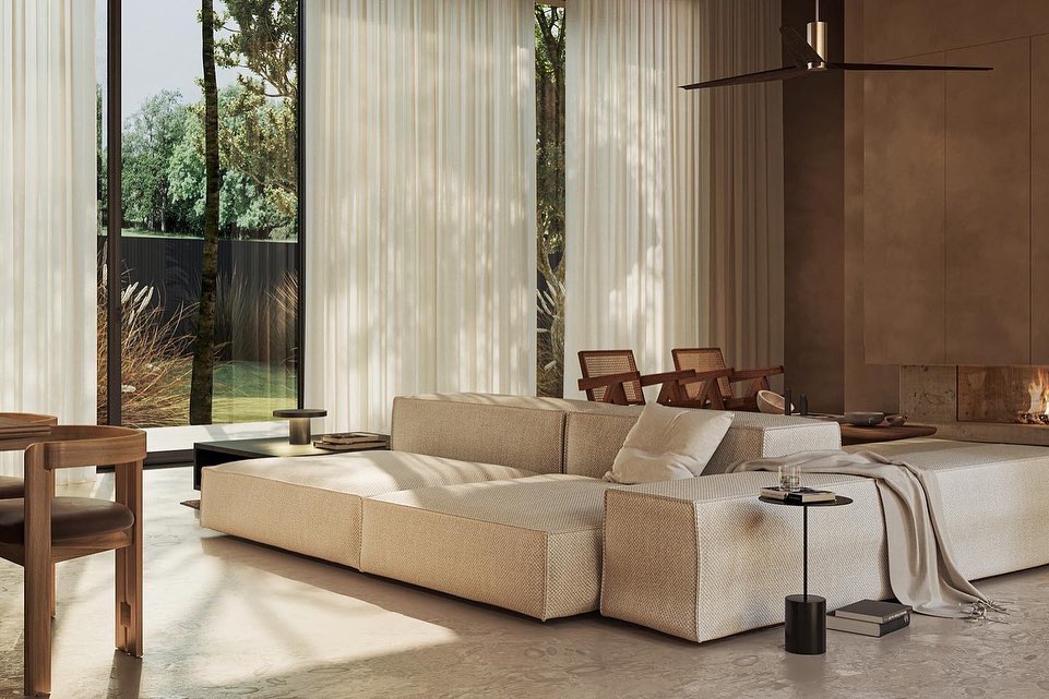 A Spacious and Minimalist Living Room with Large Windows Overlooking a Lush Outdoor Landscape