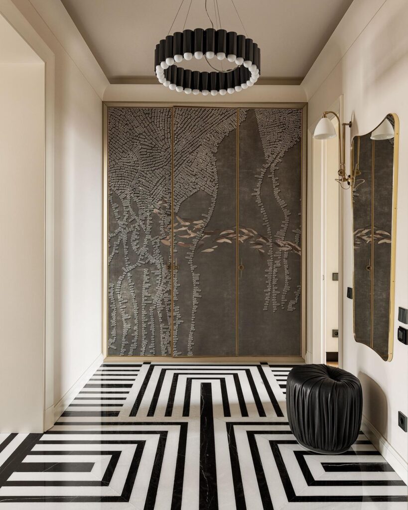 Striking Entryway Design with Geometric Patterns and Artistic Wall Panels