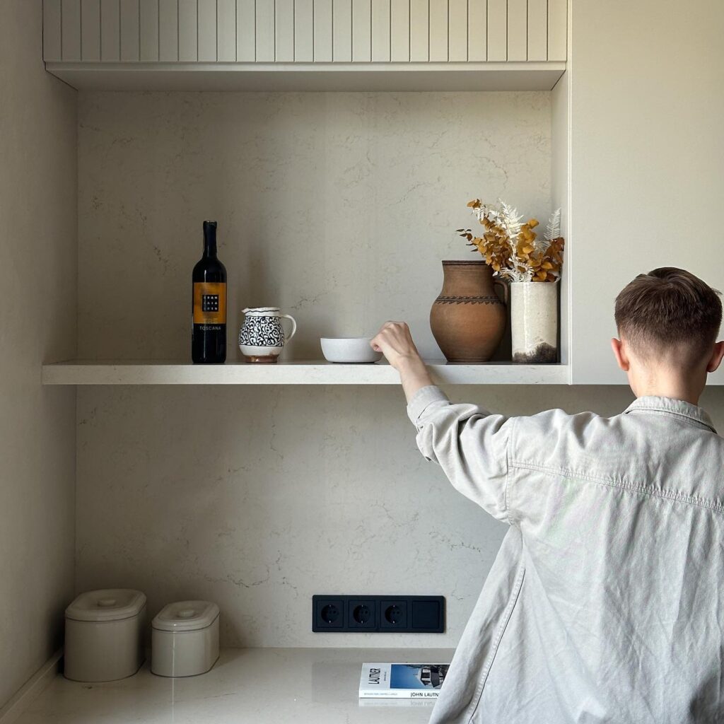 Decorative Items Arranged on Marble-Patterned Shelving Unit