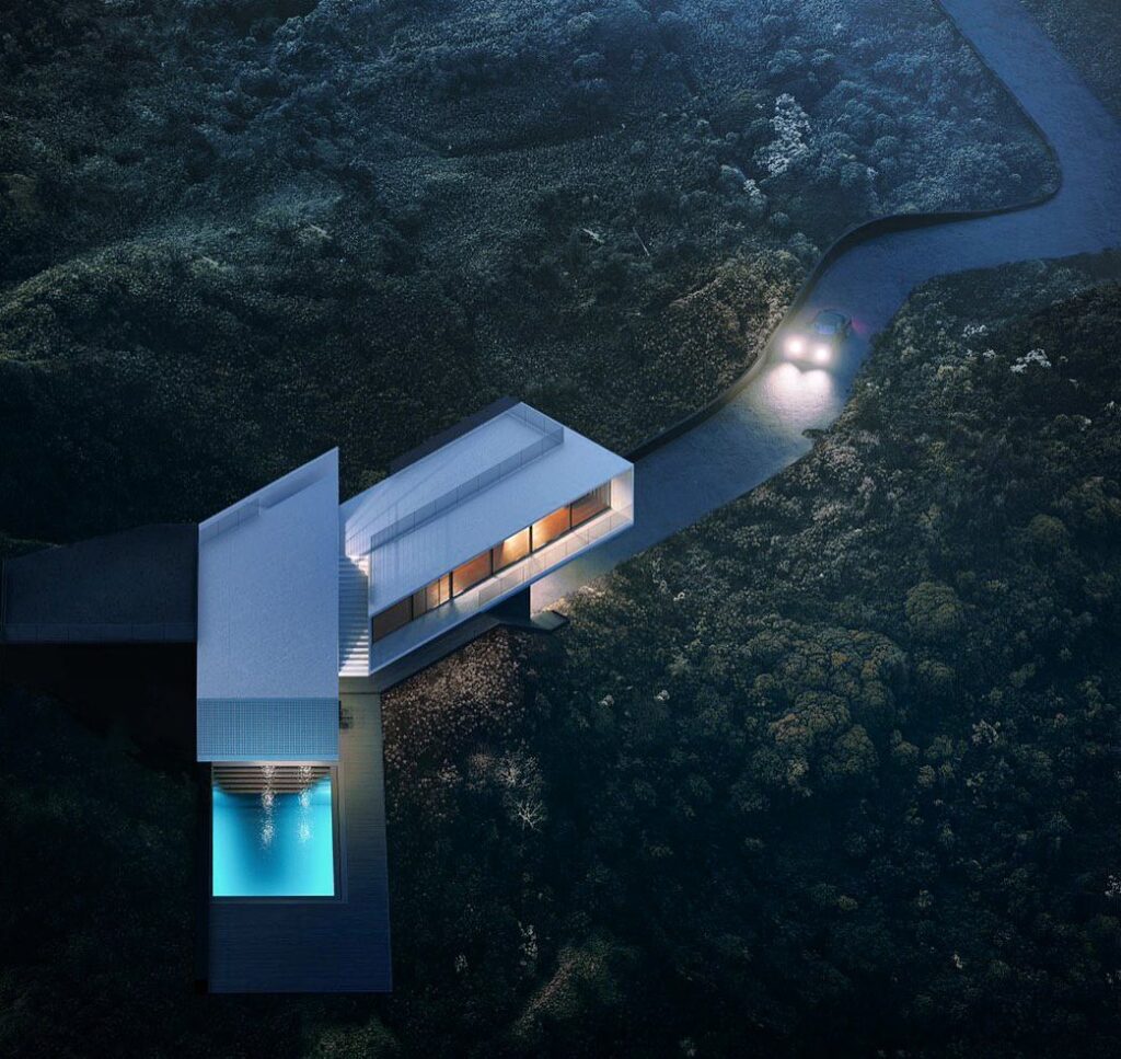 Minimalist House Perched on Cliff Overlooking Forested Landscape with River