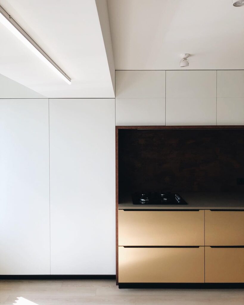 Minimalist Interior Design with Built-in Cabinets and Large Television Screen