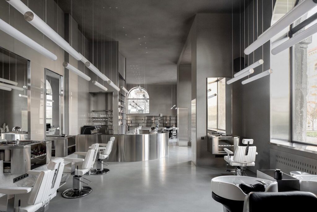 A modern interior design of a salon space with sleek and minimalist decor.