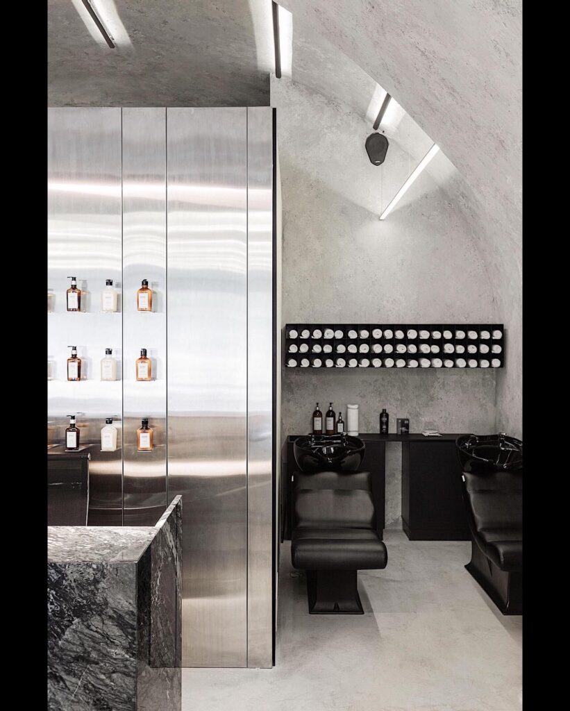 Sleek Mirrored Cabinets and Beauty Products in Minimalist Interior Design Space