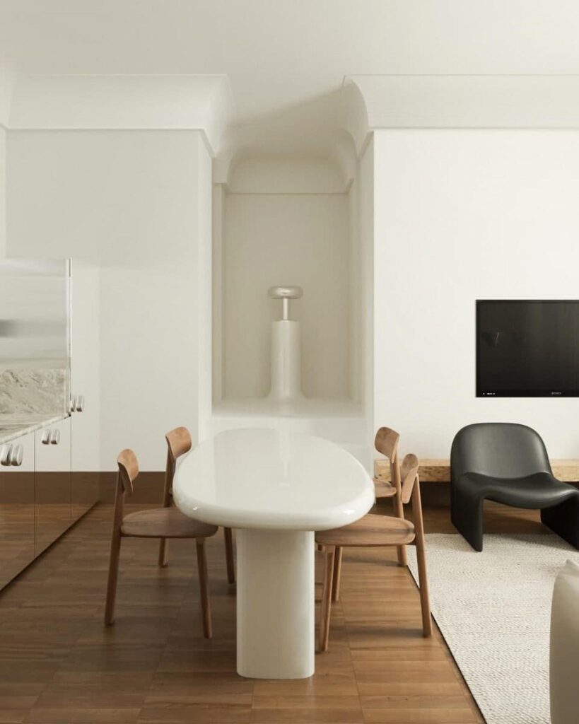 Minimalist Interior Design Space with White Sink, Wooden Chairs, and Black Chair