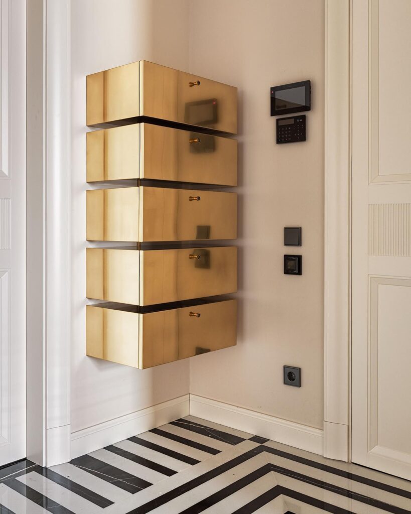 Wooden Drawers With Brass Hardware On Wall In Modern Interior